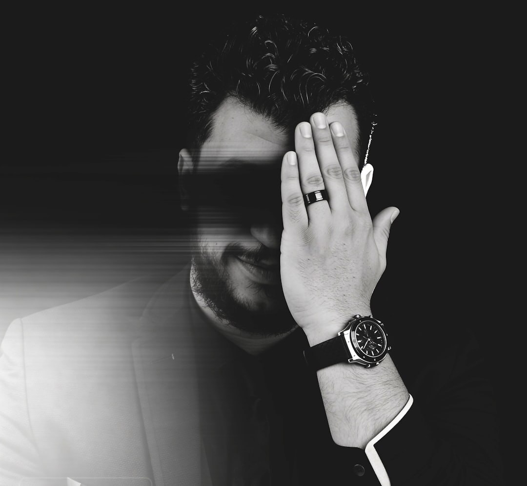 Professional man with glasses and beard in studio